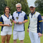 Finals Weekend 2024 - Two Wood Pairs Championship runnersup holding their cups standing with the club captain